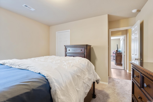 bedroom featuring light colored carpet