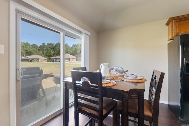 dining space with dark wood-type flooring