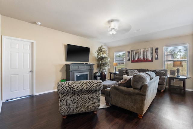 living room with vaulted ceiling, dark hardwood / wood-style flooring, and ceiling fan