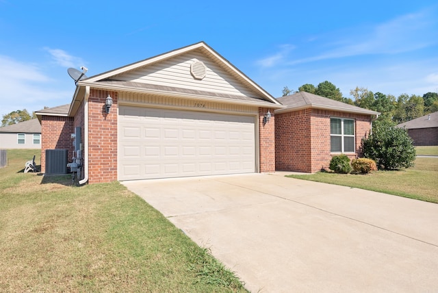 ranch-style house with a front lawn, central air condition unit, and a garage