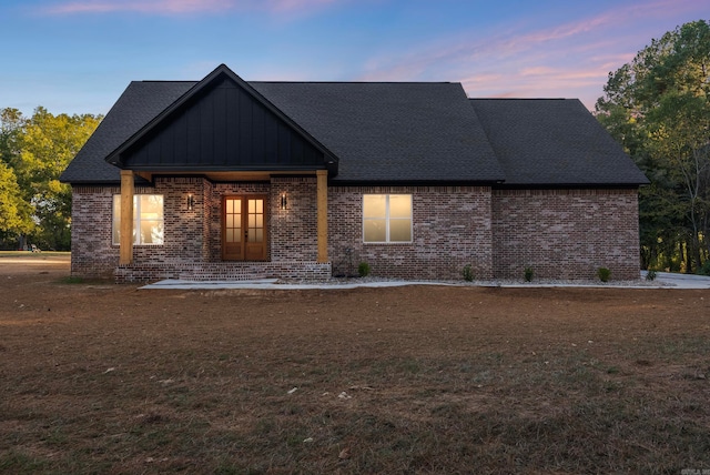 view of front of property with a lawn