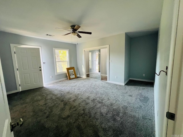 interior space with ceiling fan