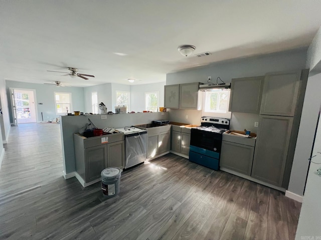 kitchen featuring gray cabinetry, electric range, ceiling fan, dark wood-type flooring, and stainless steel dishwasher