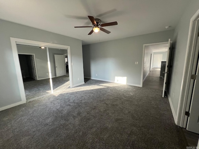 unfurnished bedroom featuring baseboards, ceiling fan, and carpet flooring
