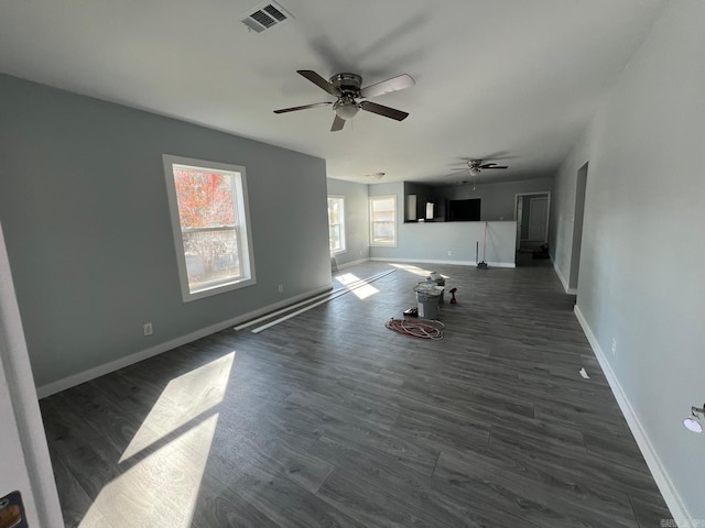 unfurnished living room with dark hardwood / wood-style floors and ceiling fan