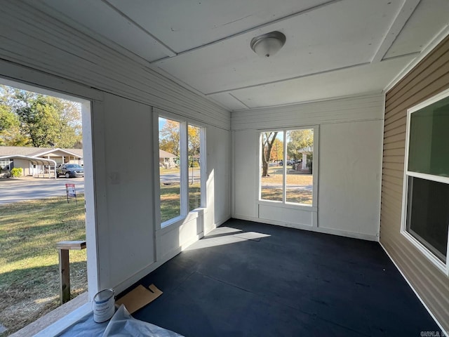 unfurnished sunroom with plenty of natural light