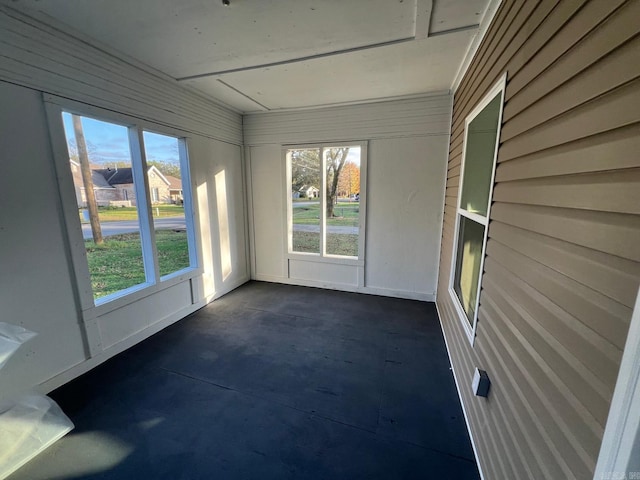 unfurnished sunroom with plenty of natural light