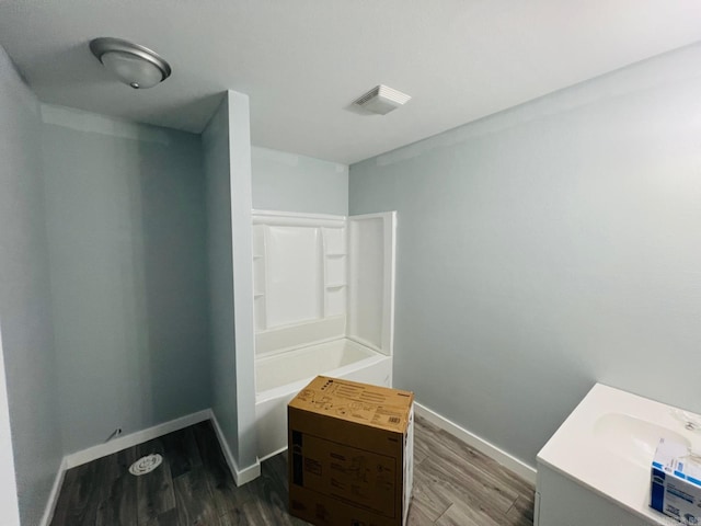 bathroom with hardwood / wood-style floors and vanity