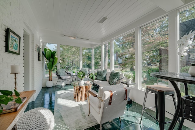 sunroom / solarium featuring wood ceiling