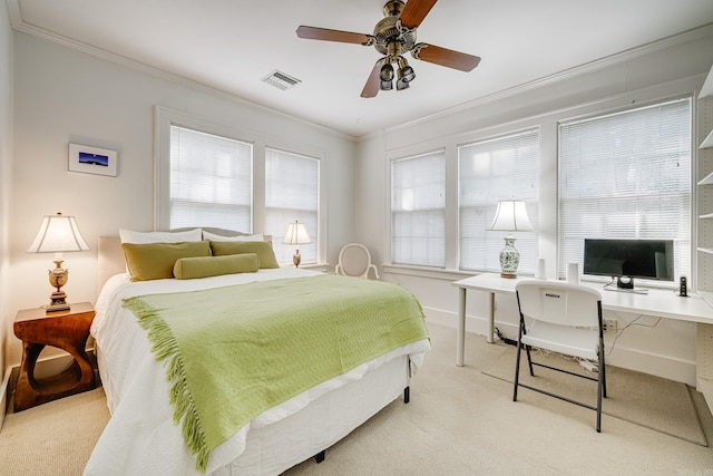 bedroom with light carpet, crown molding, and ceiling fan