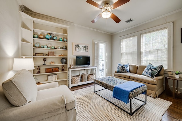 living room with crown molding, hardwood / wood-style floors, and ceiling fan