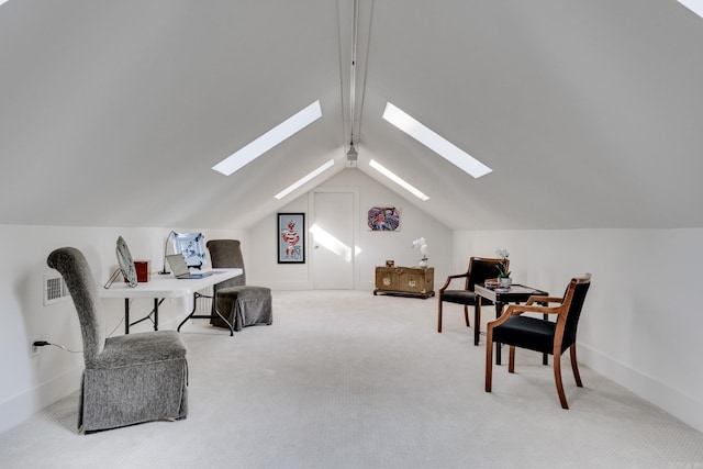 interior space featuring lofted ceiling with skylight