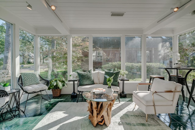 sunroom with beam ceiling