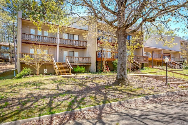 back of house featuring a wooden deck