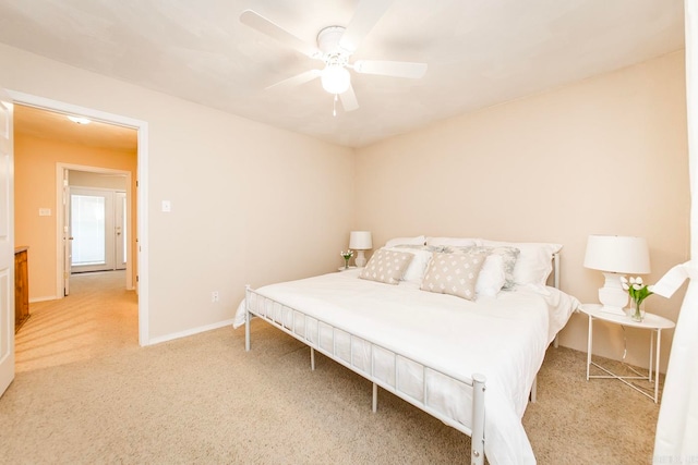 bedroom with light colored carpet and ceiling fan