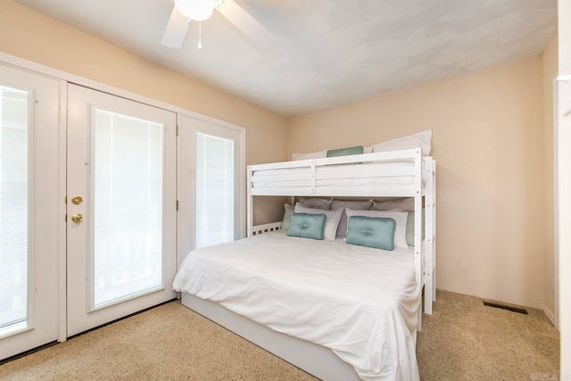 bedroom with light carpet and ceiling fan