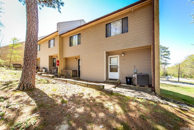 back of property featuring cooling unit