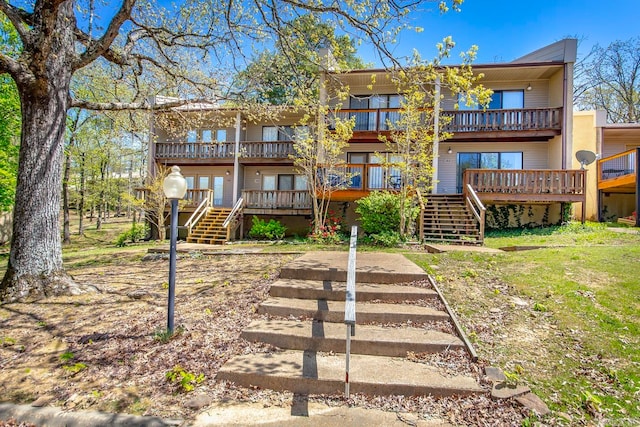 back of house with a wooden deck