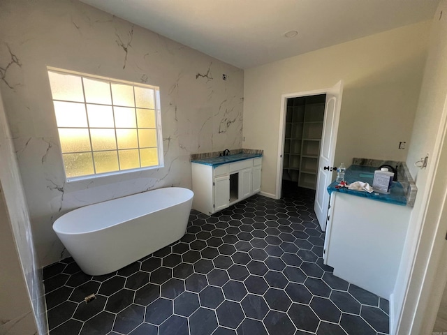 bathroom featuring vanity and a bathtub