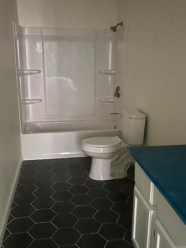 full bathroom with tile patterned flooring, vanity, tub / shower combination, and toilet