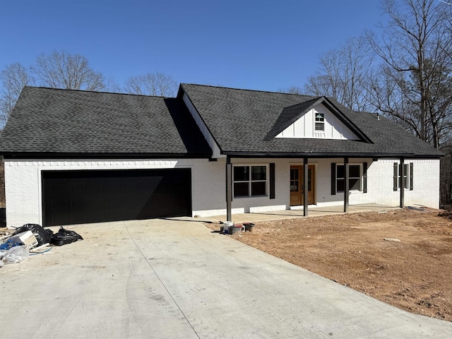 view of front of home featuring a garage and covered porch