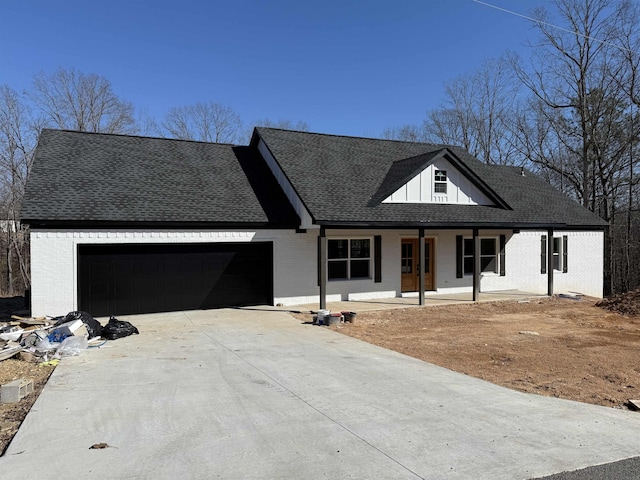 view of front of property featuring a garage and covered porch