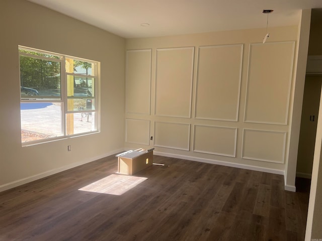 unfurnished room with dark wood-type flooring