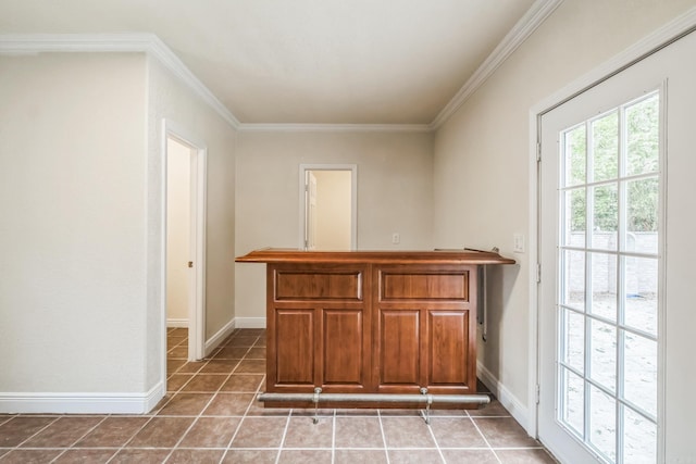 bar featuring tile patterned floors and ornamental molding