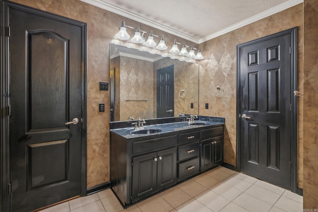 bathroom featuring vanity, crown molding, a textured ceiling, and tile patterned flooring