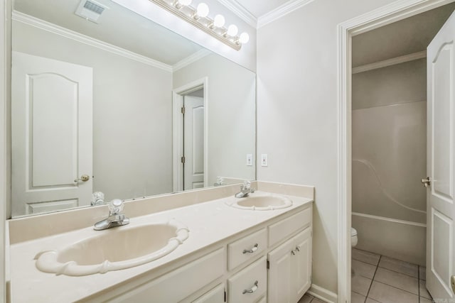 bathroom with toilet, a washtub, vanity, crown molding, and tile patterned floors