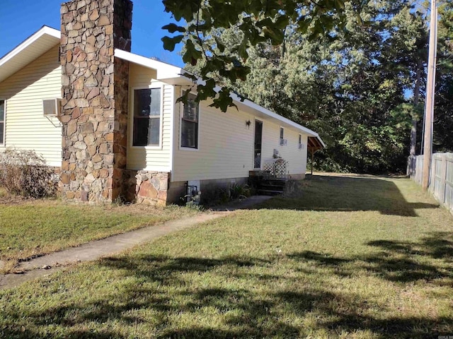 view of property exterior featuring a lawn