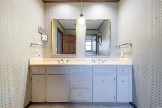 bathroom with vanity and ornamental molding