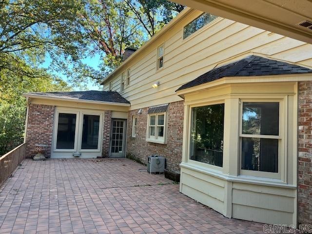 back of house featuring a patio and central AC unit