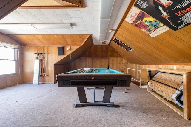 recreation room featuring vaulted ceiling, wooden walls, and carpet floors