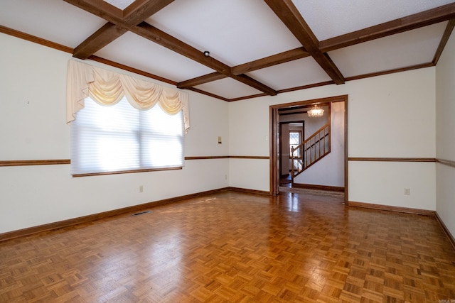 spare room featuring parquet flooring and beam ceiling