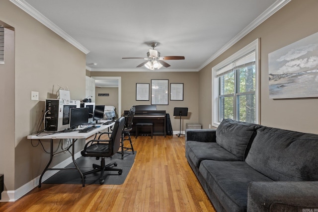 office with ornamental molding, ceiling fan, light wood finished floors, and baseboards