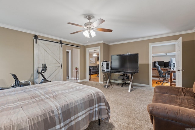 carpeted bedroom with a barn door, baseboards, ornamental molding, and a ceiling fan