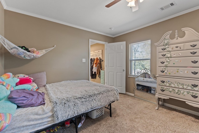 bedroom with crown molding, visible vents, and light colored carpet