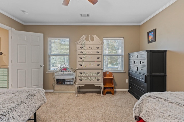 bedroom with ornamental molding, visible vents, baseboards, and light carpet