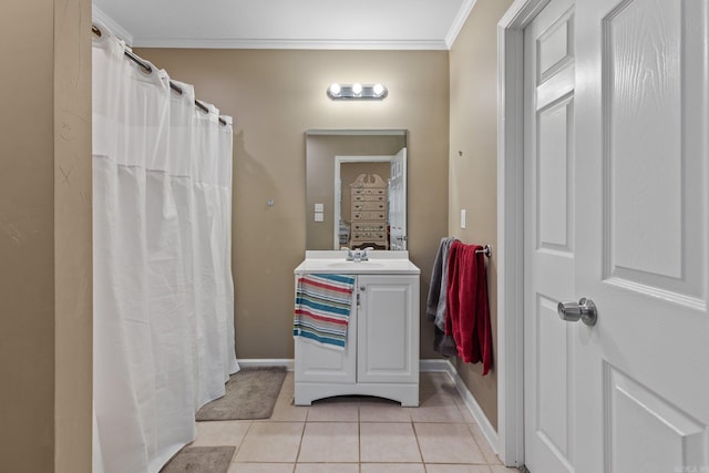 full bathroom featuring ornamental molding, baseboards, tile patterned flooring, and vanity