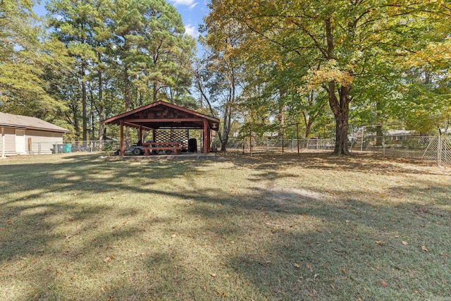 view of yard featuring a carport and fence