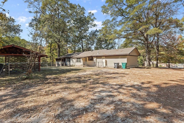 rear view of house with fence