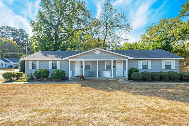 ranch-style home with a porch and a front lawn