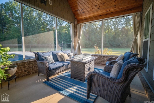 sunroom / solarium featuring wood ceiling, lofted ceiling, and plenty of natural light