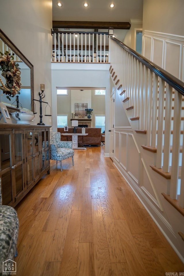 foyer featuring a high ceiling and light wood-type flooring