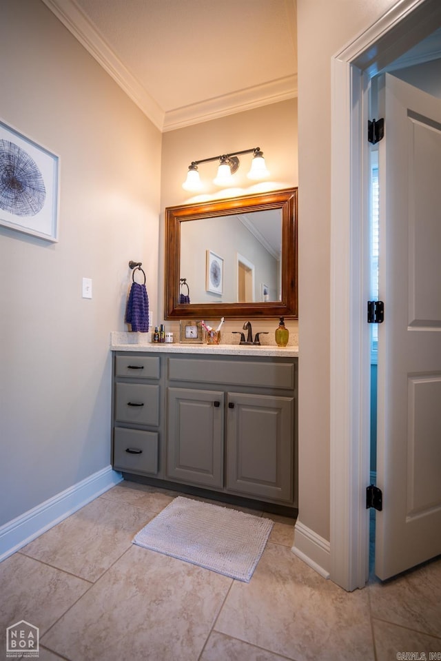 bathroom with vanity, crown molding, and tile patterned floors