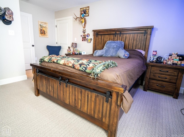 bedroom featuring light colored carpet