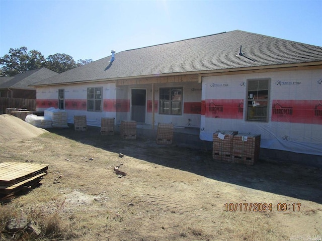 view of front of home with roof with shingles