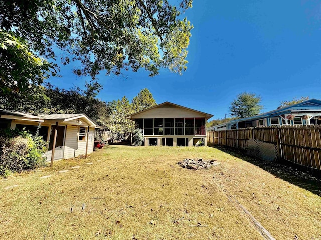 view of yard featuring a sunroom