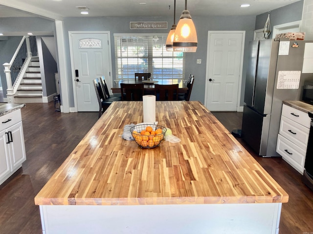 dining space featuring dark hardwood / wood-style flooring